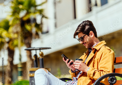 Commuter looking at his mobile phone