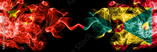 China vs Grenada smoke flags placed side by side. Thick colored silky smoke flags of Chinese and Grenada