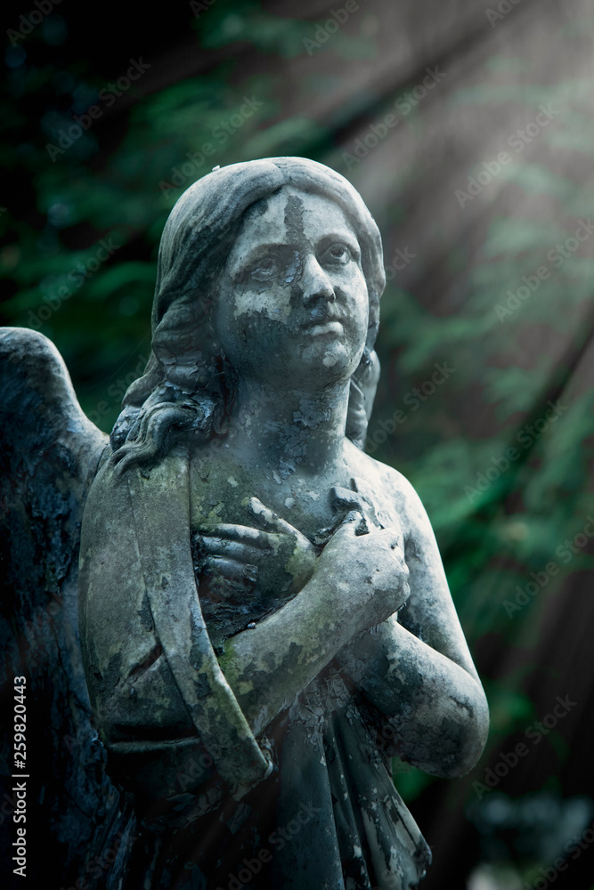 Sad angel. Antique statue. Religion, Christianity, faith, immortality, concept.
