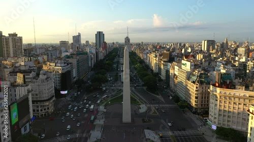 Aerial drone view of Obelisk on avenida de Julio during sunrise in a city downtown. Buenos Aires, Argentina photo