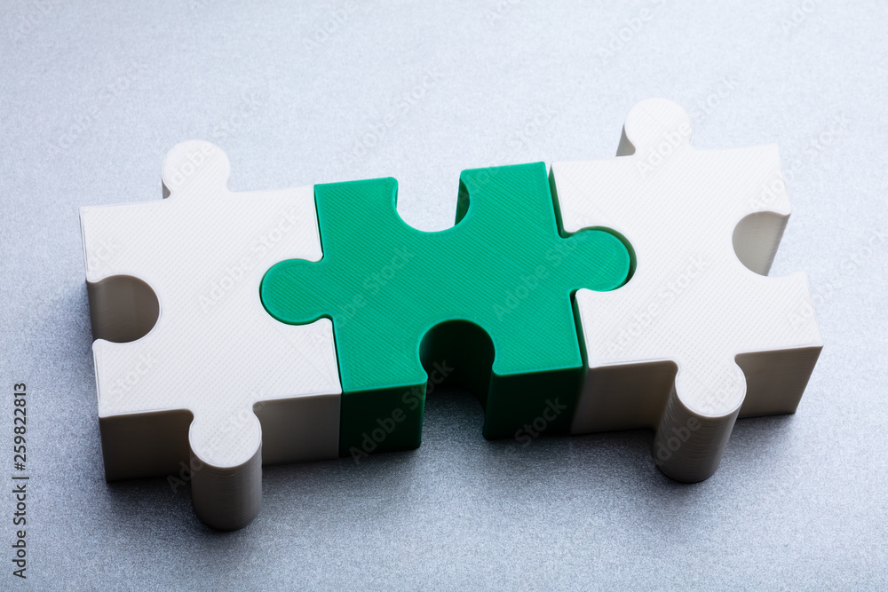 Fototapeta premium Jigsaw Puzzle Block On White Textured Background