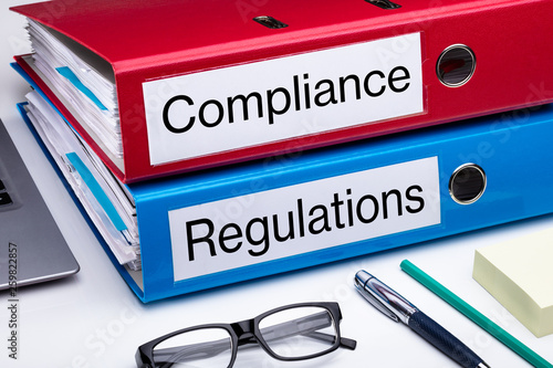 Fotografie Compliance And Regulation Folder On Office Desk