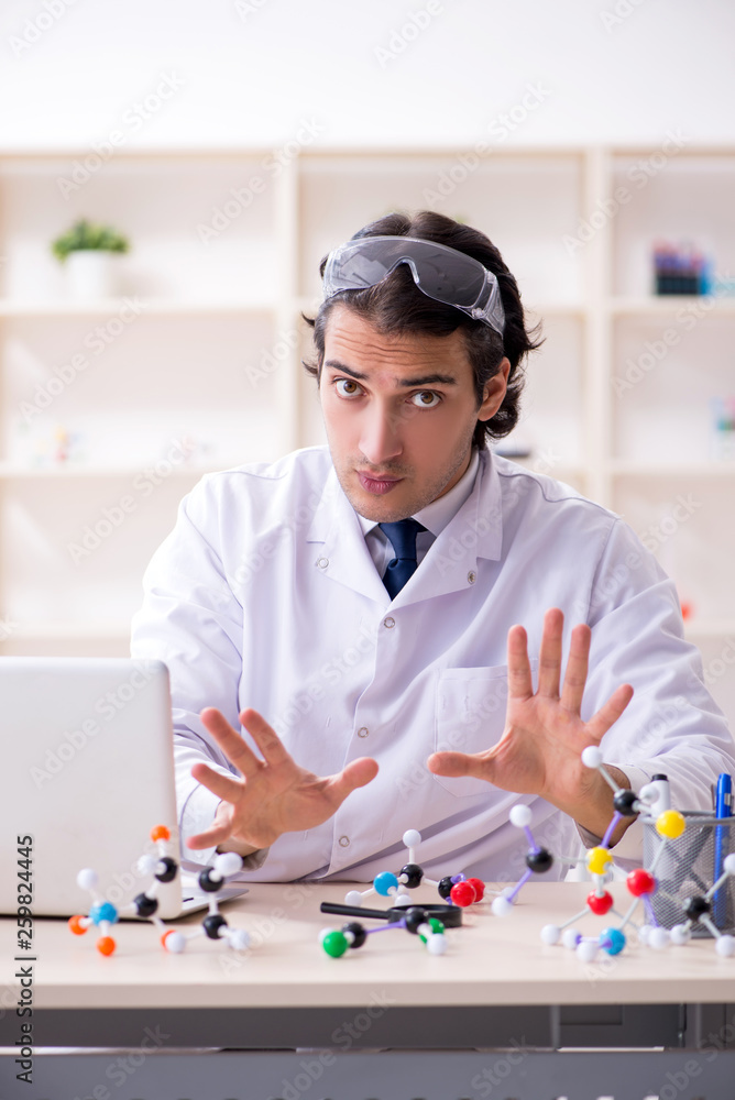 Young male scientist working in the lab Young male scientist working in the lab