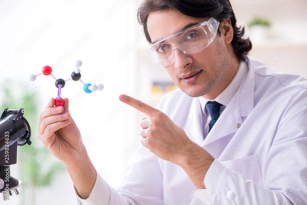 Young male scientist working in the lab Young male scientist working in the lab