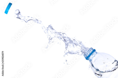 Water splash out of bottle isolated on white background.
