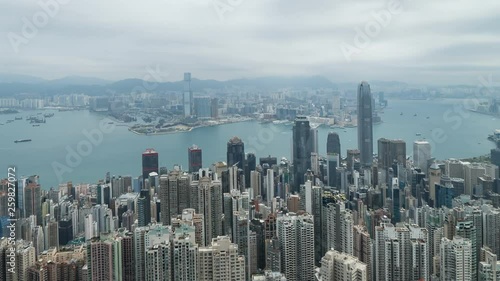 HONG KONG, CHINA - APRIL 2, 2019: 4K Cinematic Panning Right to Left Time Lapse Footage of Victoria Harbour taken from The Peak in Hong Kong during cloudy day.