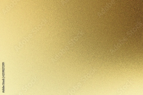 Abstract texture background, light shining on rough golden metal wall