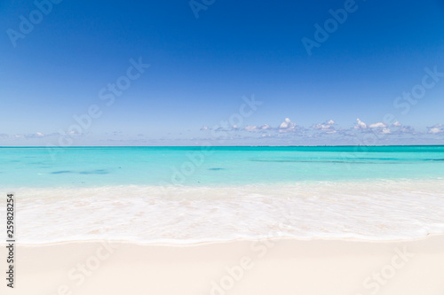 Gorgeous white sand beach and blue sky on Turks and Caicos Islands. 