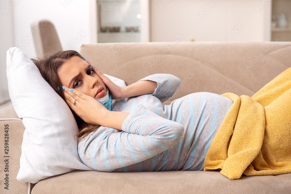 Sick pregnant woman suffering at home Sick pregnant woman suffering at home