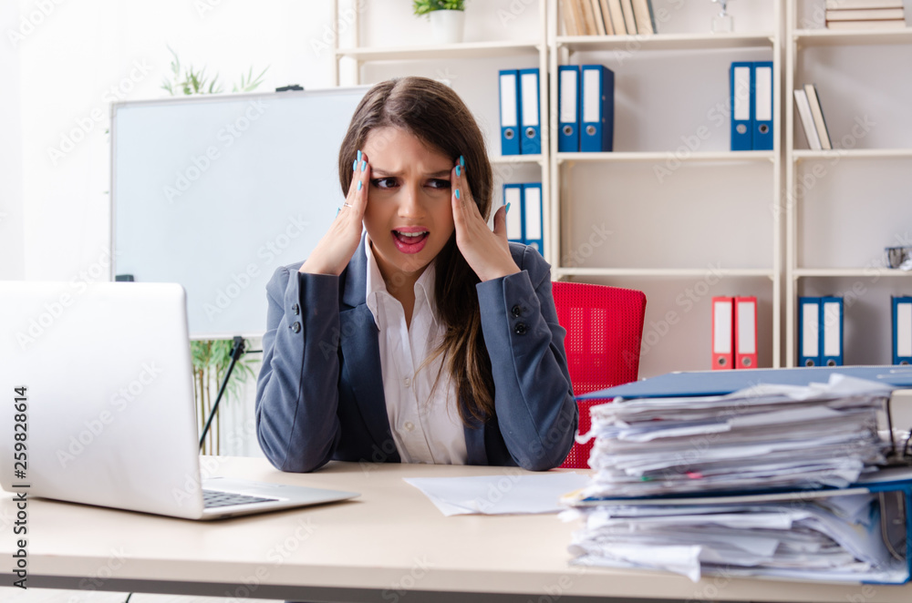 Beautiful female employee unhappy with excessive work Beautiful female employee unhappy with excessive work