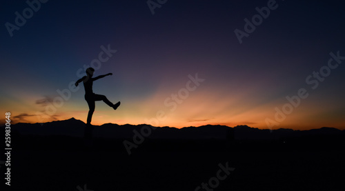 Wallpaper Mural Silhouette of man doing walking at sunset, Concept lifestyle freedom vacation travel. Torontodigital.ca