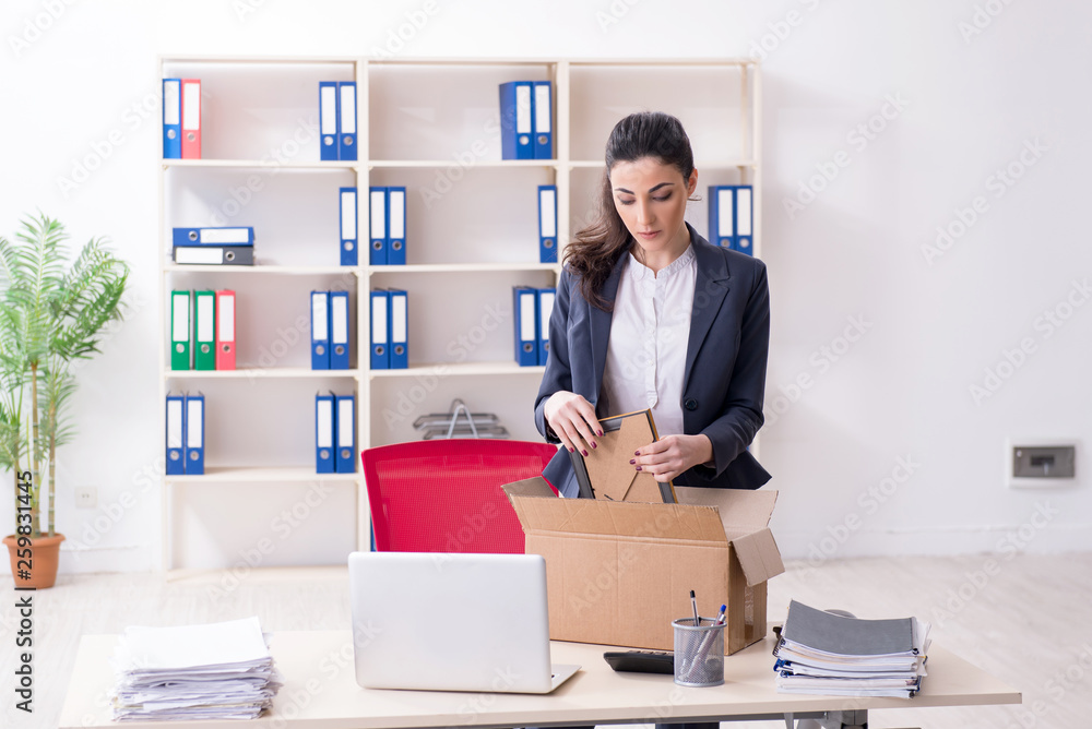 Young female employee being fired from her work Young female employee being fired from her work