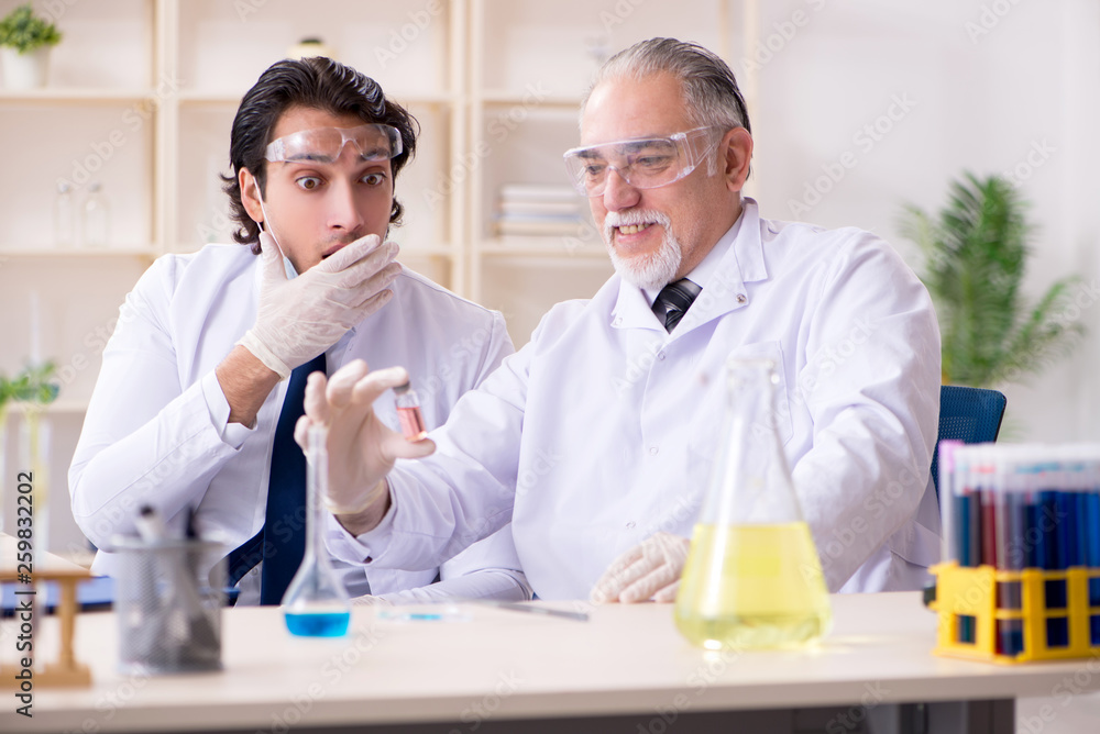 Two chemists working in the lab Two chemists working in the lab