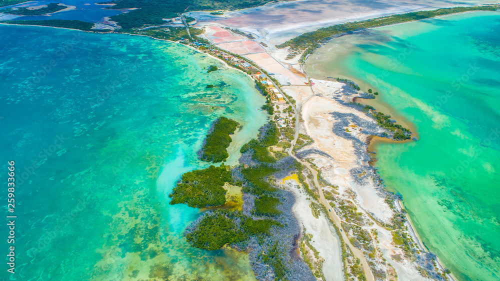 Aerial view of Puerto Rico. Faro Los Morrillos de Cabo Rojo. Playa Sucia beach and Salt lakes in Punta Jaguey. Aerial view of Puerto Rico. Faro Los Morrillos de Cabo Rojo. Playa Sucia beach and Salt lakes in Punta Jaguey.