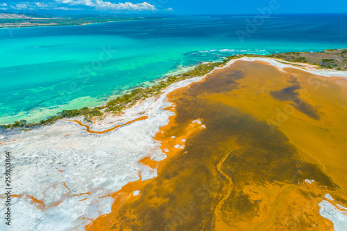 Aerial view of Puerto Rico. Faro Los Morrillos de Cabo Rojo. Playa Sucia beach and Salt lakes in Punta Jaguey.  photo