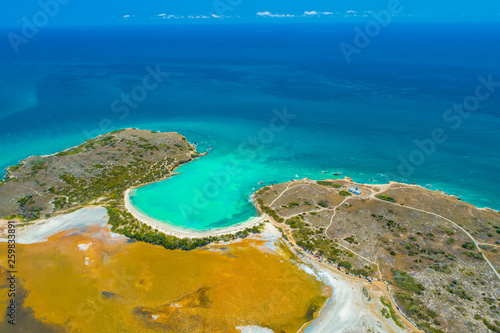 Aerial view of Puerto Rico. Faro Los Morrillos de Cabo Rojo. Playa Sucia beach and Salt lakes in Punta Jaguey.  photo
