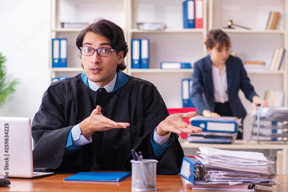 Two lawyers working in the office Two lawyers working in the office