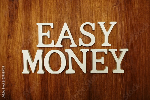 Easy Money word alphabet letters on wooden background © may1985