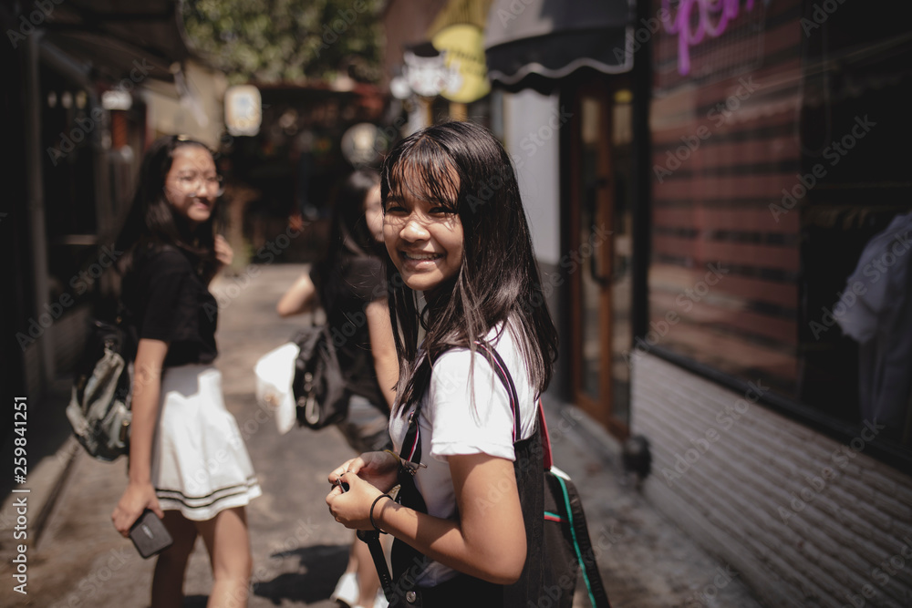 asian teenager group walking in city street happiness emotion asian teenager group walking in city street happiness emotion