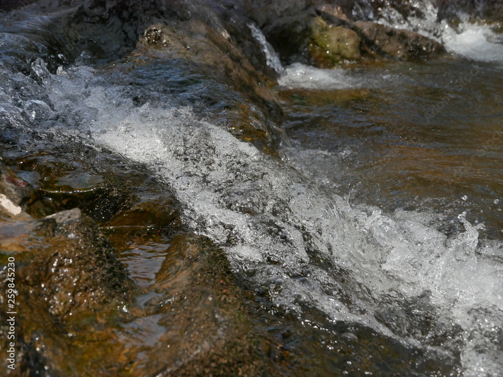 water flowing over rocks water flowing over rocks