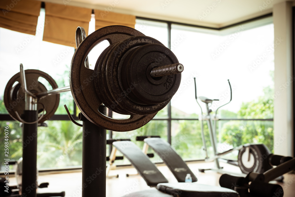 Obraz premium Empty fitness gymnasium with sport tools.Barbells for athlete exercise bodybuilding before match