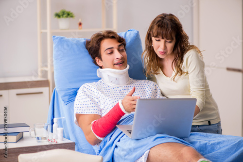 Loving wife looking after injured husband in hospital 