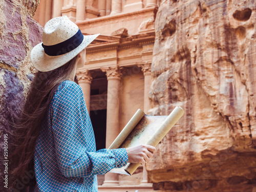 Fashionable woman, exploring the sights of the ancient, fabulous city of Petra in Jordan. Colorful photos. Concept of leisure, vacation and travel