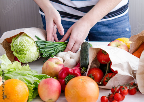 women's hands lay out eco vegan products photo