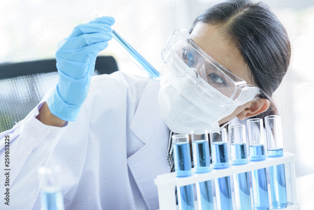 Asian young girl student scientist researching and learning in a laboratory. Asian young girl student scientist researching and learning in a laboratory.