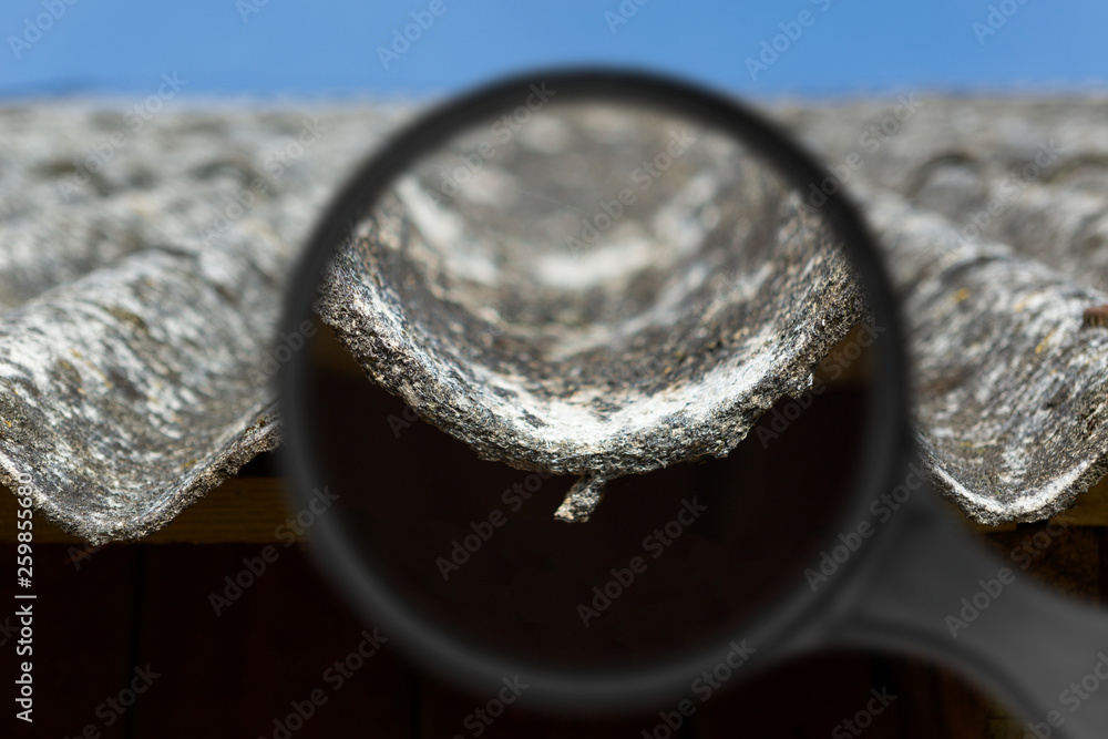 Old and very dangerous asbestos roof. Asbestos dust in the environment