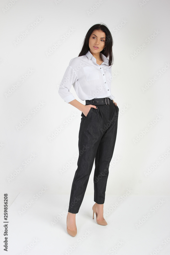 Fashion photo of young beautiful female model in dress. Studio photo Fashion photo of young beautiful female model in dress. Studio photo