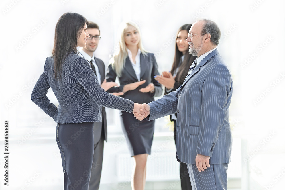 handshake of a businessman and business woman handshake of a businessman and business woman