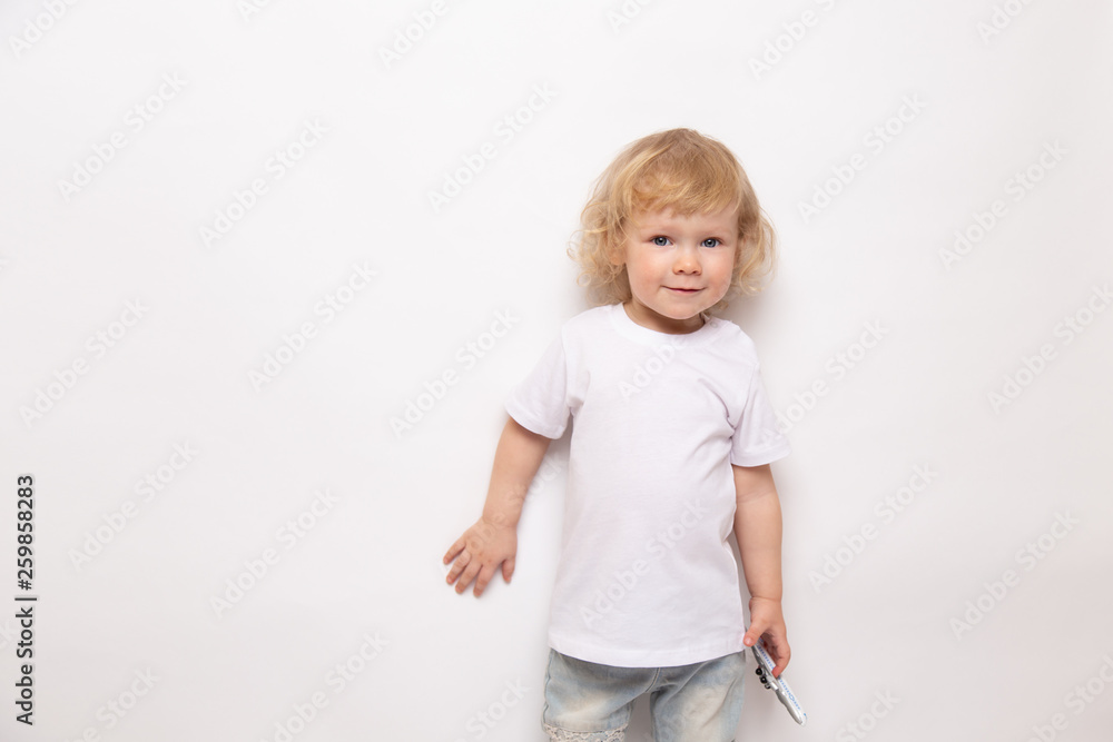 child playing with toy airplane against on a white background. concept dreams of flight child playing with toy airplane against on a white background. concept dreams of flight