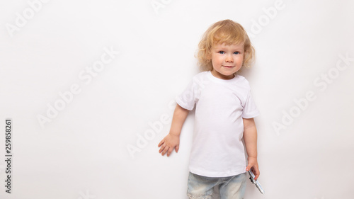 banner child playing with toy airplane against on a white background. concept dreams of flight