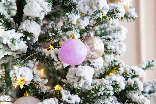Christmas toys and balls on the branches of the Christmas tree