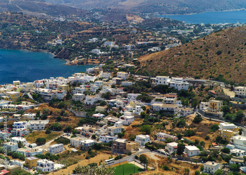 View to leros island. White houses contrast with blue sea. Greek island.
