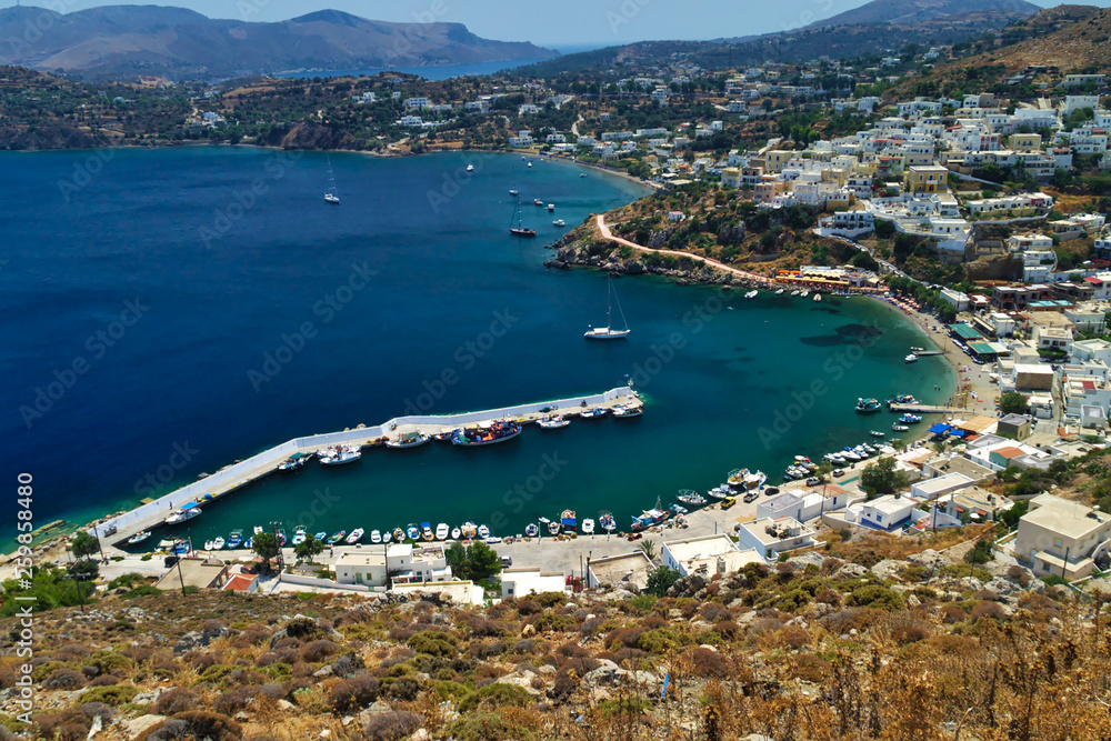 View to Panteli port in leros island. White houses contrast with blue sea. Greek island.