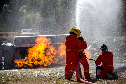 Firefighters are practicing fire fighting in a virtual situation.