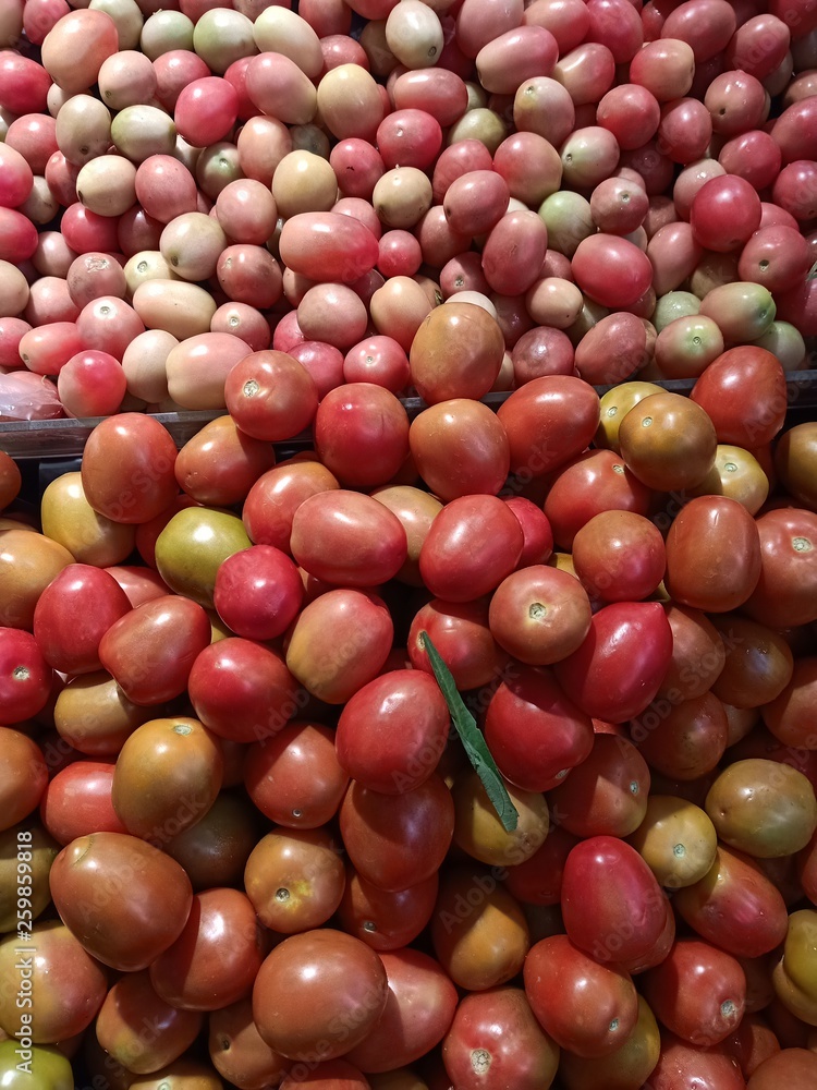 Tomatoes are sold in the market for selling fruits and vegetables.