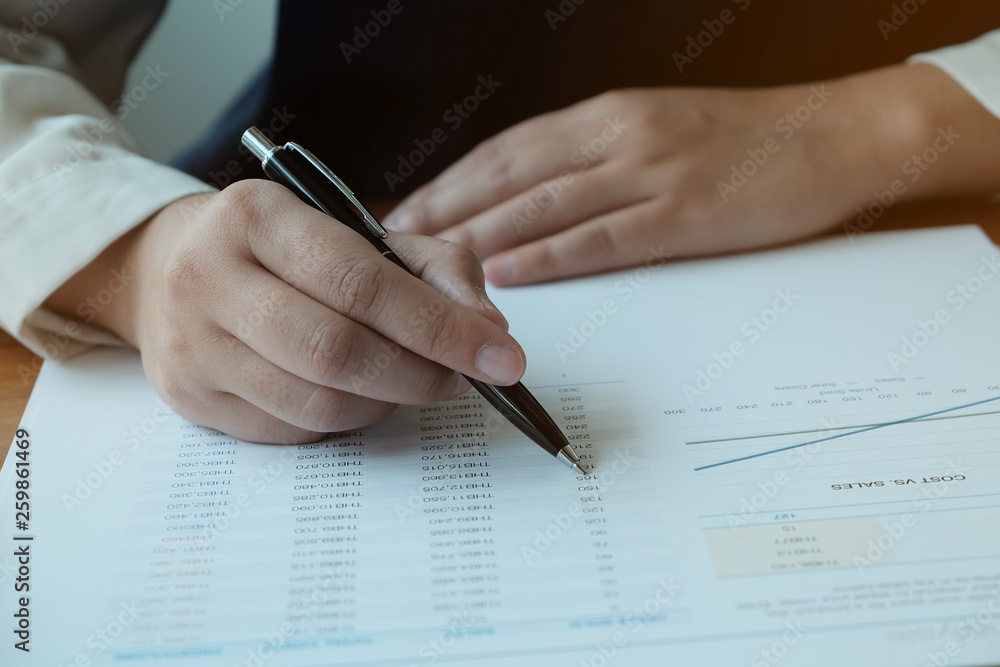 Business People Meeting Design Ideas with pen analyzing financial documents professional investor working new start up project. Concept. business planning in office. Business People Meeting Design Ideas with pen analyzing financial documents professional investor working new start up project. Concept. business planning in office.