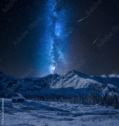 Mountains, milky way and small cottages at night, Poland