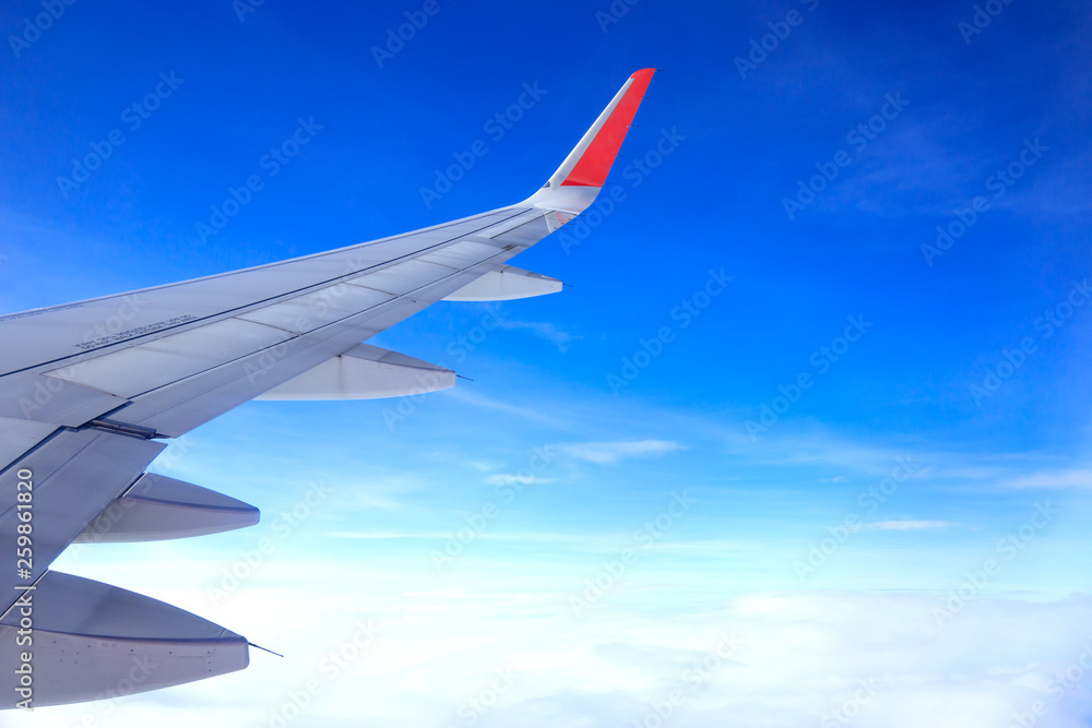 airplane wing with many clouds in the sky airplane wing with many clouds in the sky
