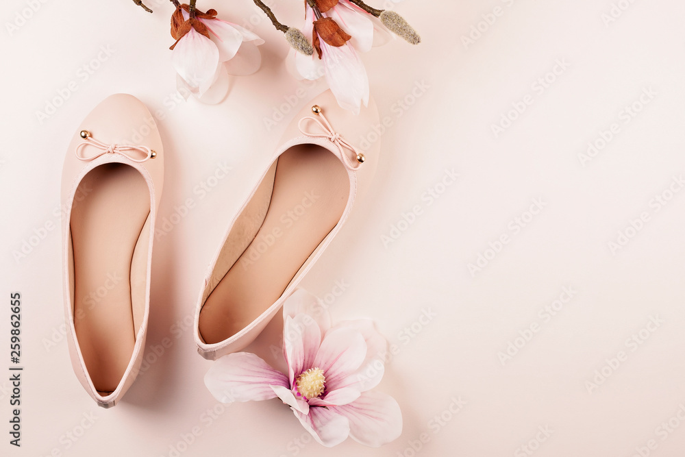 Nude colored ballerina shoes and magnolia flowers. - obrazy, fototapety, plakaty 