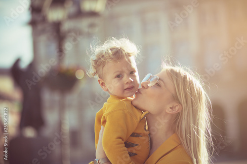 Mom is full of kisses for her child. © liderina