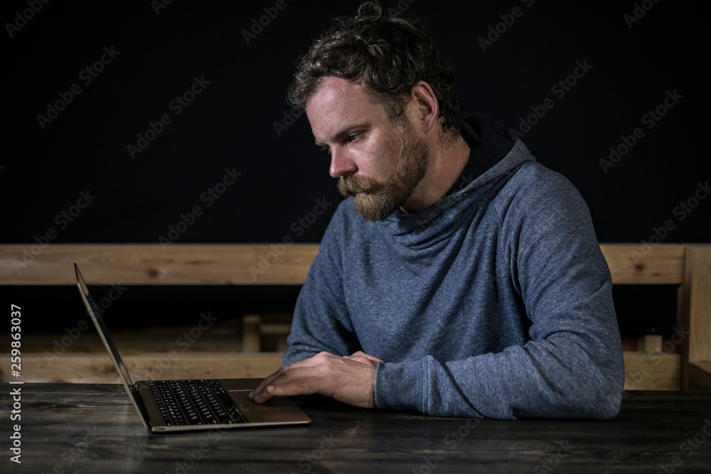mustache hipster with a beard works at the computer mustache hipster with a beard works at the computer