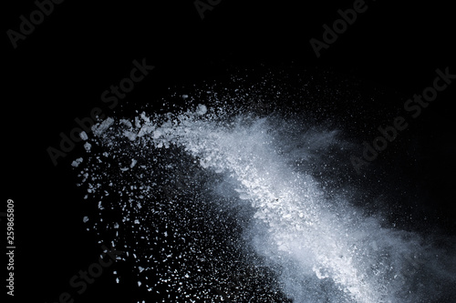 abstract powder splatted background Freeze motion of color powder exploding throwing color powder color glitter texture on black background.