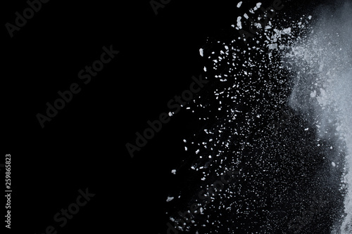 abstract powder splatted background,Freeze motion of color powder exploding throwing color powder,color glitter texture on black background.