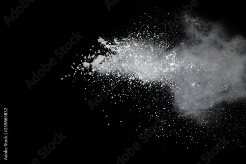 abstract powder splatted background,Freeze motion of color powder exploding throwing color powder,color glitter texture on black background.