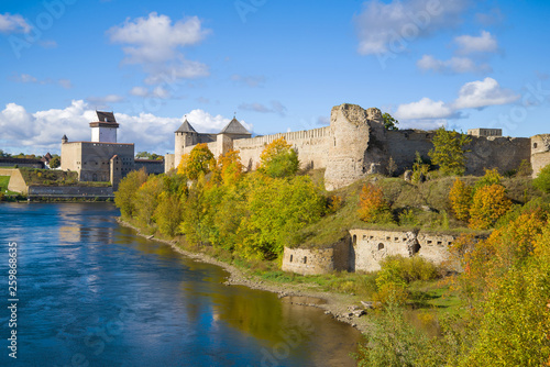 View of the Herman castle and Ivangorod fortress in the golden autumn. Border of Russia and Estonia