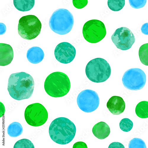 Seamless pattern with painted watercolor green and blue polka dots